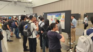 Yossi showing poster