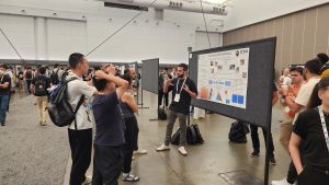Roy showing poster